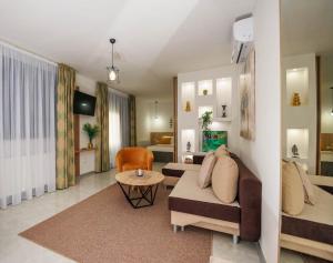 a living room with a couch and a table at Villa Elena in Grabovac