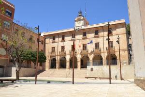 a large building with a clock tower on top of it at Loreto N1 in Denia