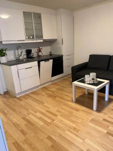 a living room with a couch and a table at Apartment in Åsane in Bergen