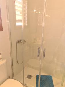 a bathroom with a shower and a toilet at Aurora BeachHouse 300m from the beach with large beaitiful terrace in Arenales del Sol