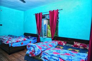 Ένα ή περισσότερα κρεβάτια σε δωμάτιο στο Shankara Homestay Rudranath