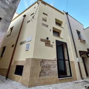 a building with stairs on the side of it at la chiocciola in Mesagne