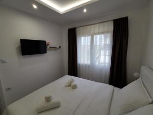 Ένα ή περισσότερα κρεβάτια σε δωμάτιο στο Tahtidis 2