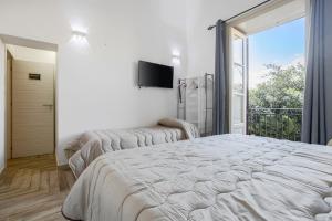 Posteľ alebo postele v izbe v ubytovaní Calypso Il Binario Elegance