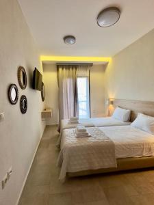 Postel nebo postele na pokoji v ubytování Yulia Luxury Apartments
