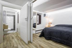 Posteľ alebo postele v izbe v ubytovaní Calypso Il Binario Elegance
