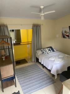 Un pat sau paturi într-o cameră la Descanso do Jordão