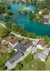 an aerial view of a house next to a river at VILLA Maatoug in Bihać