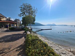 a view of a body of water with a pier at Castagneto House in Baveno