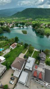 an aerial view of a river with houses and a town at Villa Al Nemah in Bihać