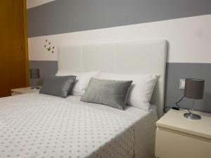 Posteľ alebo postele v izbe v ubytovaní Garatuxa Home