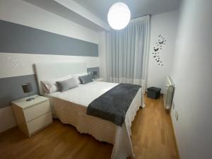 Posteľ alebo postele v izbe v ubytovaní Garatuxa Home