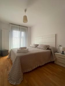 Posteľ alebo postele v izbe v ubytovaní Garatuxa Home