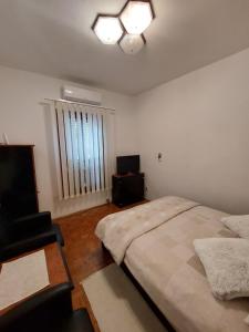 Postel nebo postele na pokoji v ubytování City apartment Amfora