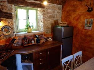 Kuchyňa alebo kuchynka v ubytovaní Cottage al Merlo Olivo