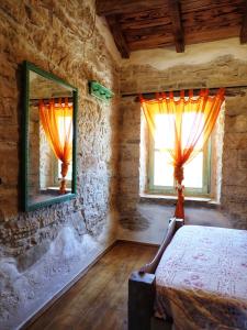 Posteľ alebo postele v izbe v ubytovaní Cottage al Merlo Olivo