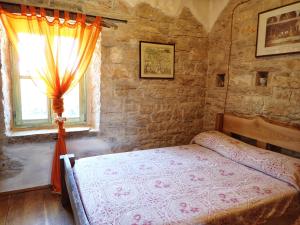 Posteľ alebo postele v izbe v ubytovaní Cottage al Merlo Olivo