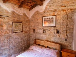 Posteľ alebo postele v izbe v ubytovaní Cottage al Merlo Olivo