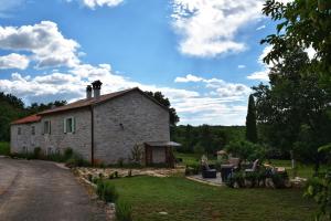 Vonkajšia záhrada v ubytovaní Cottage al Merlo Olivo