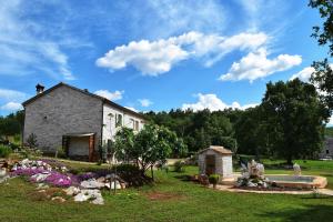 Vonkajšia záhrada v ubytovaní Cottage al Merlo Olivo