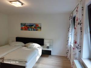 Postel nebo postele na pokoji v ubytování Lenne-Blick Ferienwohnung