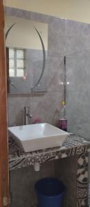 a bathroom with a white sink and a mirror at Villa Ste Marie in Sainte Marie +25 photos