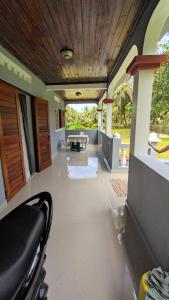 a view of a living room with a table and chairs at Villa Ste Marie in Sainte Marie