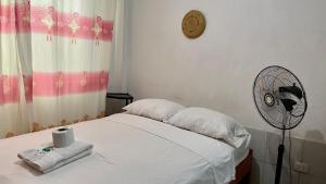Postel nebo postele na pokoji v ubytování Hospedaje Casa Amazónica Iquitos