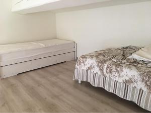 a bedroom with a bed and a dresser in it at Domaine Le Mas Sans Soucis in Fayence