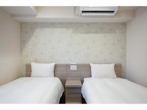 Krevet ili kreveti u jedinici u objektu Kuretake Inn Premium Tajimi Ekimae