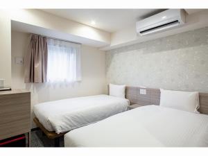 Krevet ili kreveti u jedinici u objektu Kuretake Inn Premium Tajimi Ekimae