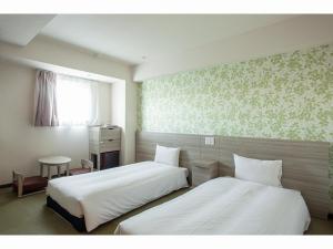 Krevet ili kreveti u jedinici u objektu Kuretake Inn Premium Tajimi Ekimae