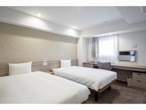 Krevet ili kreveti u jedinici u objektu Kuretake Inn Premium Tajimi Ekimae