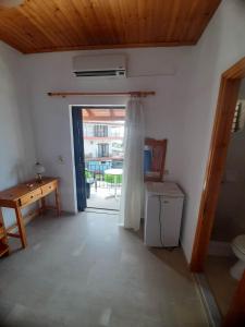 Kuchyň nebo kuchyňský kout v ubytování Christina Sunny Rooms