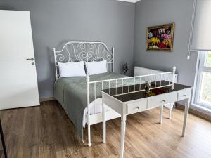 a bedroom with a bed with a desk and a bed sidx sidx sidx at Your Home in the Heart of Nature! -9 persons in Gemlik