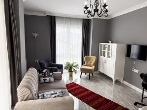 a living room with a couch and a tv at Your Home in the Heart of Nature! -9 persons in Gemlik
