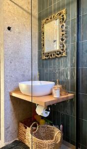 a bathroom with a sink and a mirror at almond home in Livadia