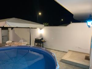 a swimming pool in a backyard at night at Luna Luxury in Lecce