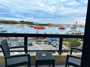 a view of a harbor with boats in the water at Galileo Rooms in Il- Gżira