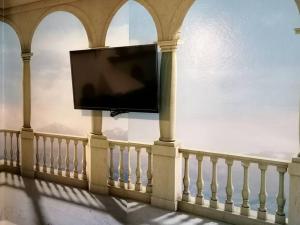 Et tv og/eller underholdning på Apartamento en casa rural con amplio jardín a 5 min de la playa
