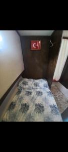 a small bed in the corner of a room at Yakamoz A in Marmaris