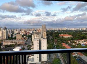 a view of a city from a balcony at BookSampa Apto Aconchegante Alto da Boa Vista in Sao Paulo