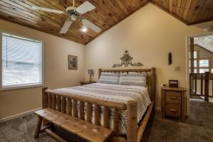 a bedroom with a bed and a wooden ceiling at Berg Stuga, Free Attraction Tickets, Game Room, Hot Tub, WIFI!!! in Townsend +59 photos