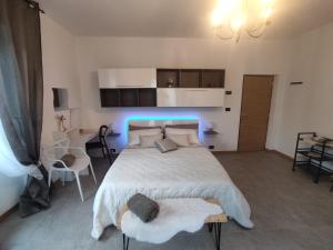 a bedroom with a bed with a blue light at Tirano Express luxury Apartment in Tirano