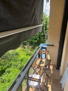 a balcony with a table and chairs on a porch at Danube Sunrise in Kladovo