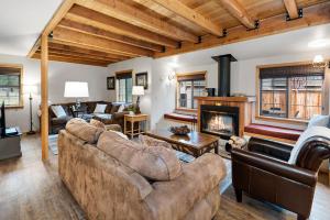 a living room with a couch and a fireplace at 18 Deer Lane in Sunriver
