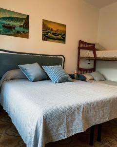 a bedroom with a bed and a bunk bed at Moneglia Beach Downtown in Moneglia