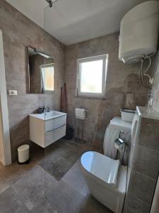 Koupelna v ubytování Apartmani Gržinić
