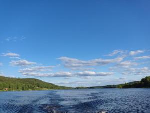 a view from a boat on a lake at Sunnemoslantliv B&B in Sunnemo +7 photos