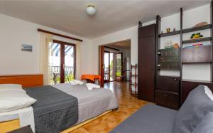 Postel nebo postele na pokoji v ubytování Apartments Djani